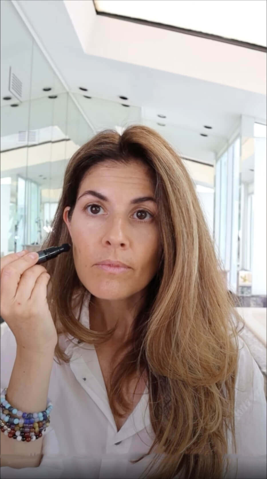 Helene Video Screen shot doing her makeup